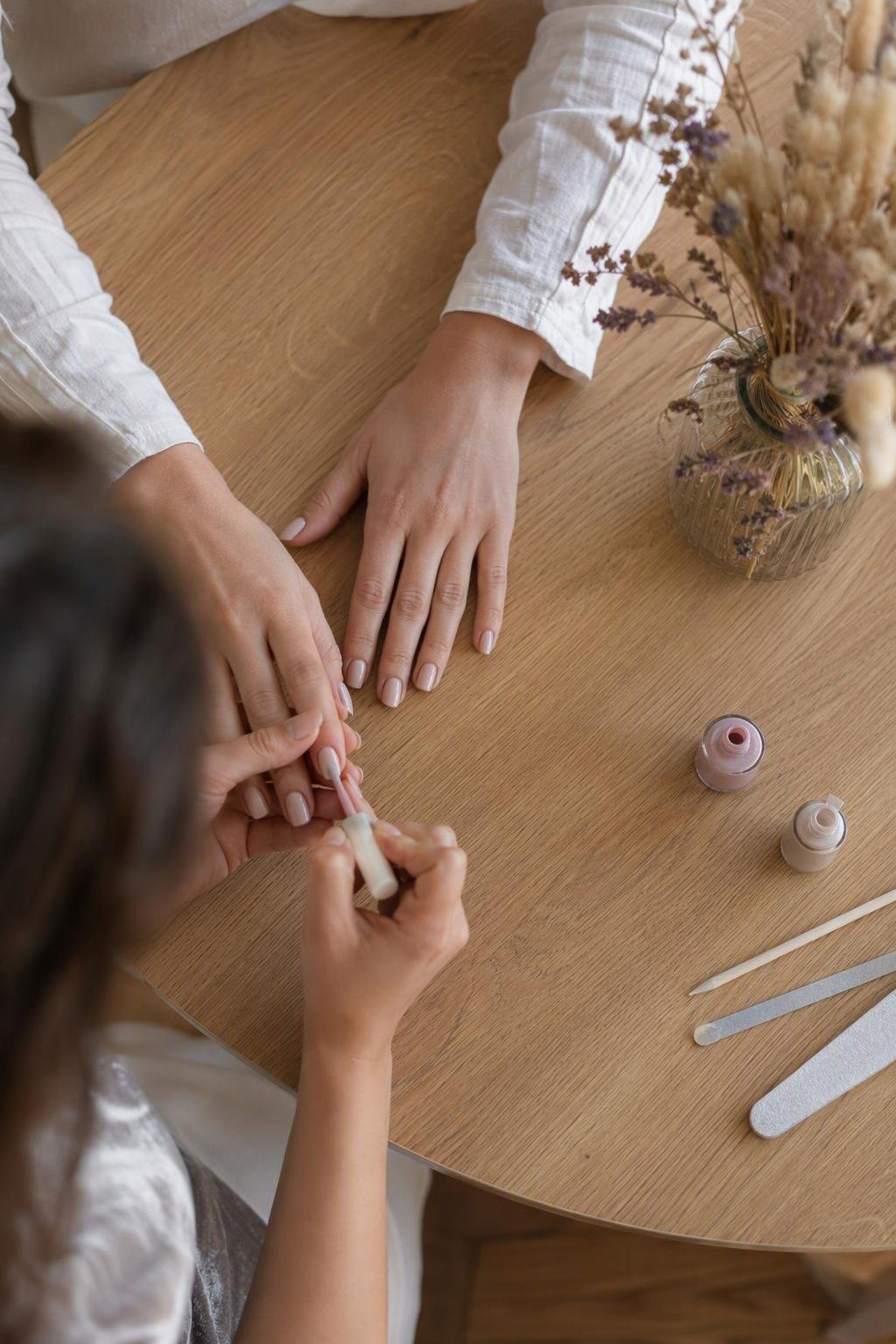 A manicure in a pale nude